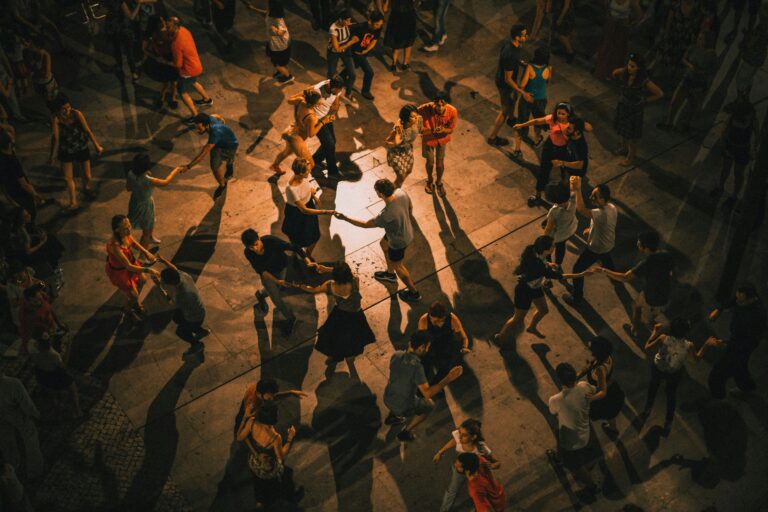 An aerial view of a large group of people dancing